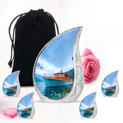 Cobalt Blue Boat Cremation Urn side profile showing urn shape - graceful tear-shaped urn with boat motif - memorial set with one large and four small urns
