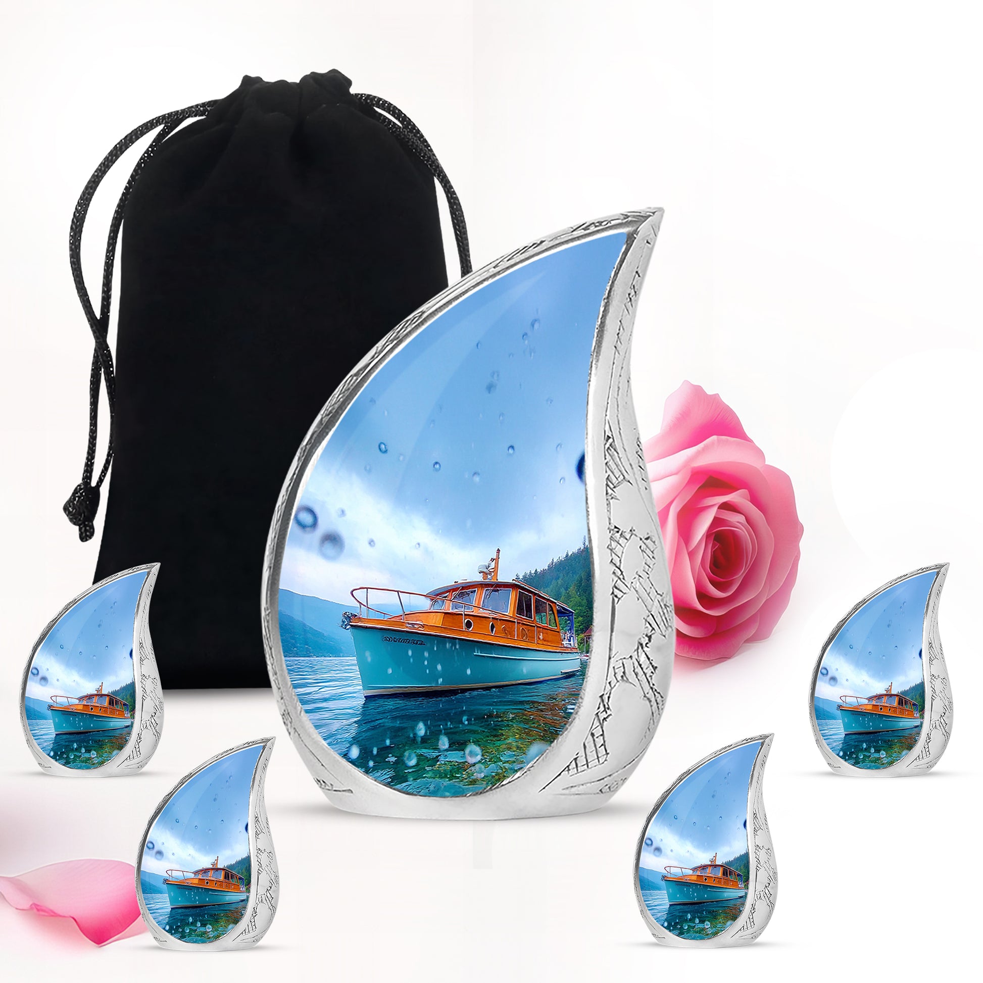 Cobalt Blue Boat Cremation Urn side profile showing urn shape - graceful tear-shaped urn with boat motif - memorial set with one large and four small urns
