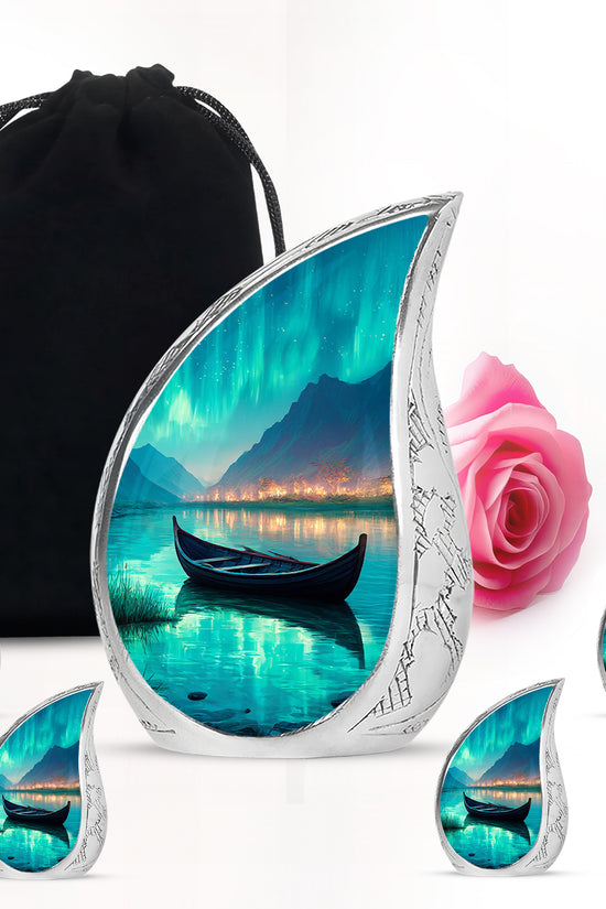 Tropical Teal Boat Cremation Urn side profile showing urn shape - smooth teardrop contour featuring boat art - memorial set with one large and four small urns