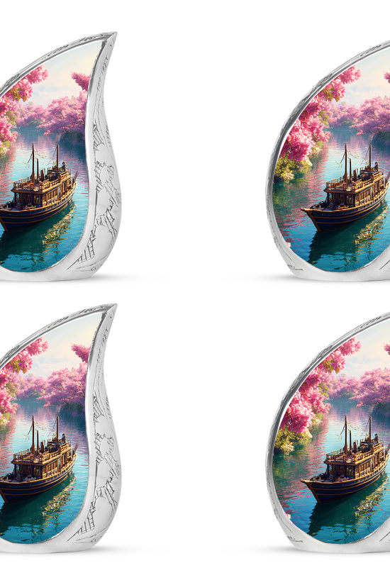 Soft Pink Boat Cremation Urn close-up of engraving and surface detail - smooth teardrop contour featuring boat art - 10 inch aluminum urn for cremated remains