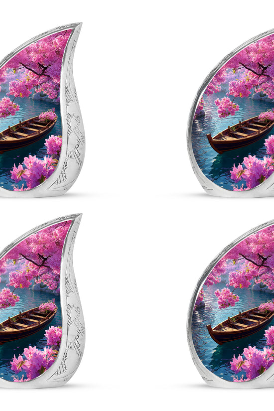 Dusty Blue Boat Cremation Urn close-up of engraving and surface detail - flowing teardrop boat silhouette on curved aluminum - 10 inch aluminum urn for cremated remains