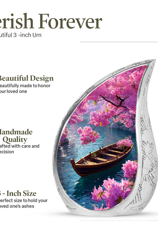 Royal Blue Boat Cremation Urn angled view of lid and engraved motif - graceful tear-shaped urn with boat motif - mini keepsake memorial for portion of cremation ashes