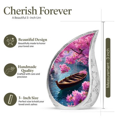 Royal Blue Boat Cremation Urn angled view of lid and engraved motif - graceful tear-shaped urn with boat motif - mini keepsake memorial for portion of cremation ashes