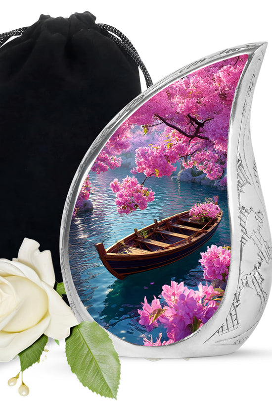 Azure Boat Cremation Urn front view showing detailed design - flowing teardrop boat silhouette on curved aluminum - full-size 10 inch 200 cubic inch adult cremation urn