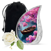 Azure Boat Cremation Urn front view showing detailed design - flowing teardrop boat silhouette on curved aluminum - full-size 10 inch 200 cubic inch adult cremation urn