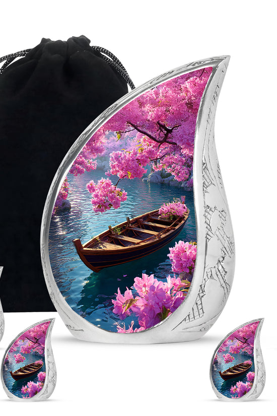 Royal Blue Boat Cremation Urn side profile showing urn shape - graceful tear-shaped urn with boat motif - memorial set with one large and four small urns