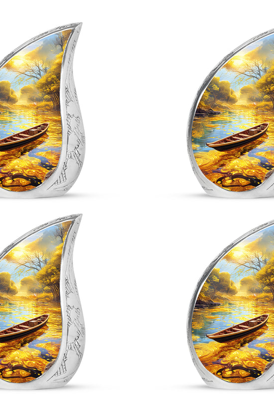 Sunrise Gold Boat Cremation Urn close-up of engraving and surface detail - flowing teardrop boat silhouette on curved aluminum - 10 inch aluminum urn for cremated remains