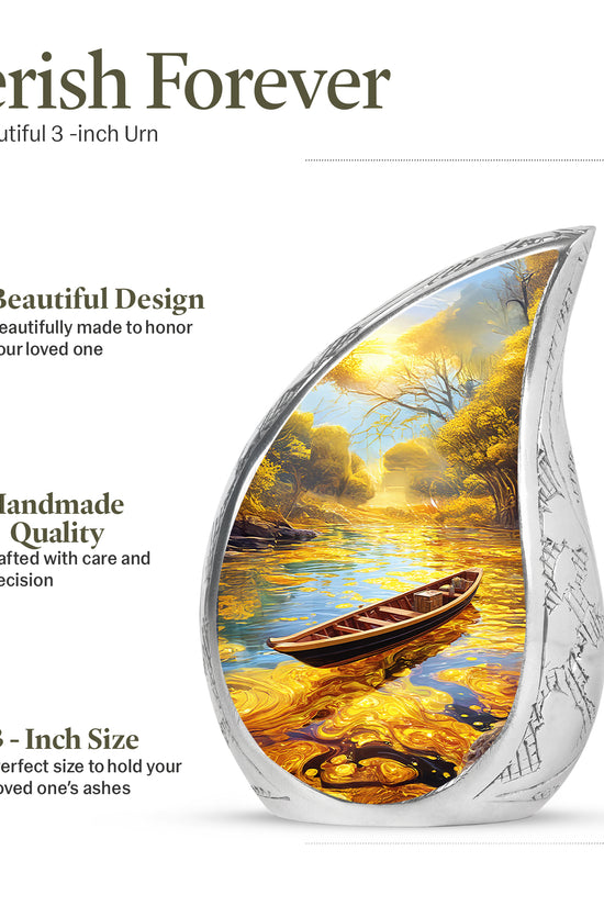 Gilded Gold Boat Cremation Urn angled view of lid and engraved motif - flowing teardrop boat silhouette on curved aluminum - mini keepsake memorial for portion of cremation ashes