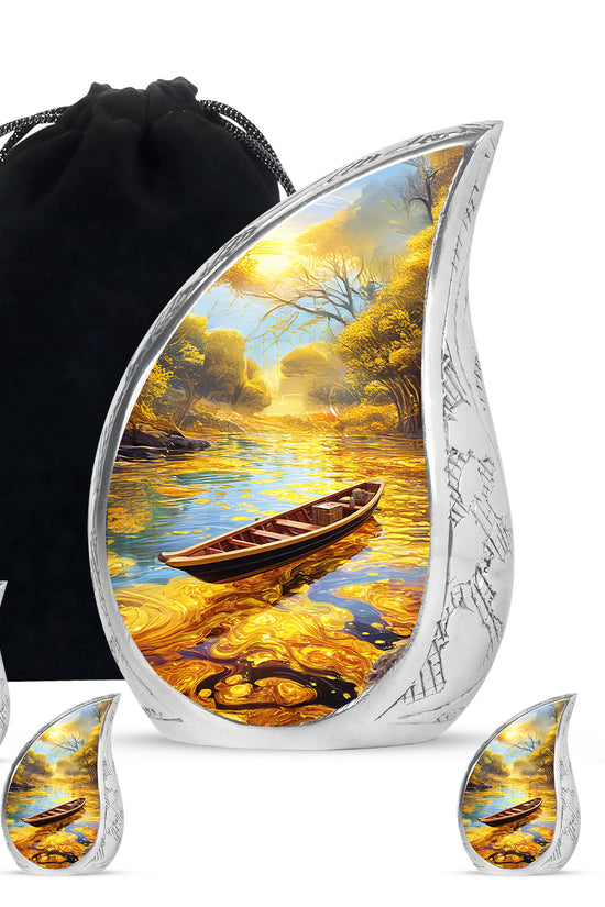 Sunrise Gold Boat Cremation Urn side profile showing urn shape - flowing teardrop boat silhouette on curved aluminum - memorial set with one large and four small urns
