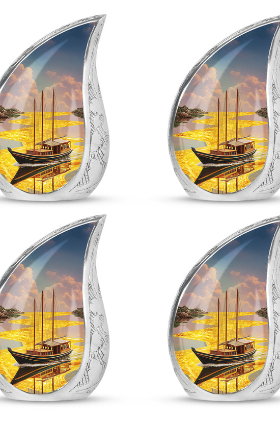Warm Gold Boat Cremation Urn close-up of engraving and surface detail - graceful tear-shaped urn with boat motif - 10 inch aluminum urn for cremated remains