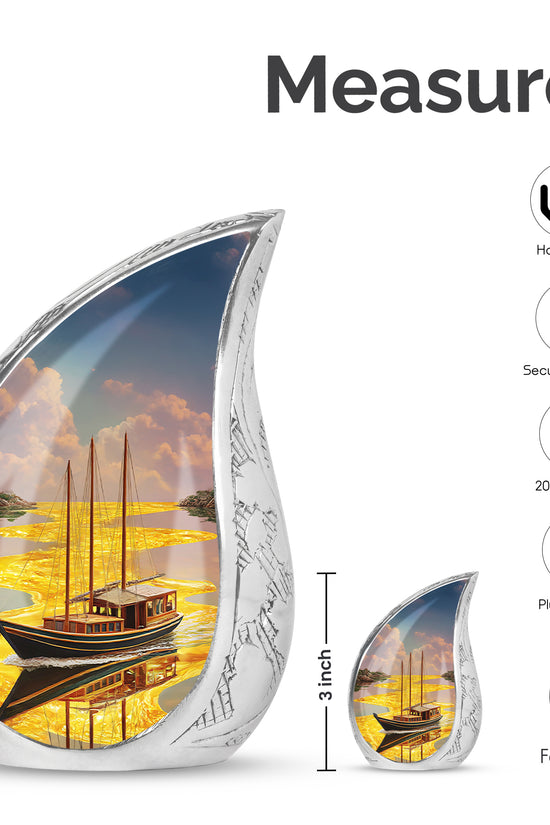 Antique Gold Boat Cremation Urn angled view of lid and engraved motif - rounded teardrop boat design with delicate detail - mini keepsake memorial for portion of cremation ashes