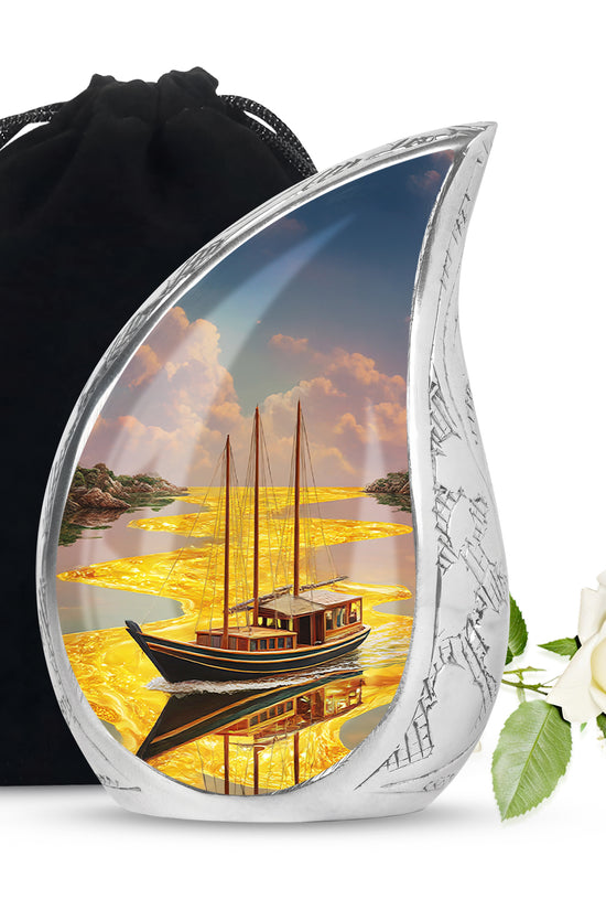 Gilded Gold Boat Cremation Urn front view showing detailed design - rounded teardrop boat design with delicate detail - full-size 10 inch 200 cubic inch adult cremation urn