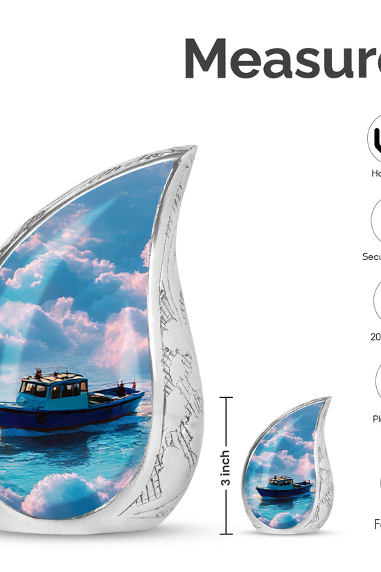Dusty Blue Boat Cremation Urn angled view of lid and engraved motif - rounded teardrop boat design with delicate detail - mini keepsake memorial for portion of cremation ashes