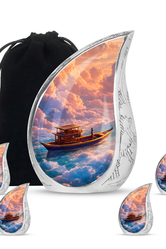 Deep Red Boat Cremation Urn side profile showing urn shape - flowing teardrop boat silhouette on curved aluminum - memorial set with one large and four small urns