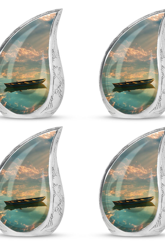 Midnight Black Boat Cremation Urn close-up of engraving and surface detail - graceful tear-shaped urn with boat motif - 10 inch aluminum urn for cremated remains