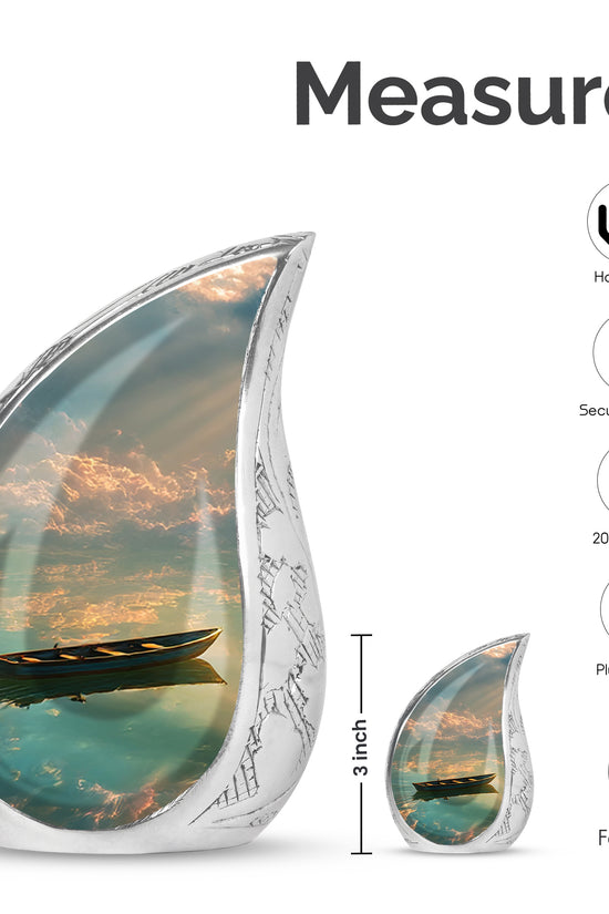 Jet Black Boat Cremation Urn angled view of lid and engraved motif - flowing teardrop boat silhouette on curved aluminum - mini keepsake memorial for portion of cremation ashes