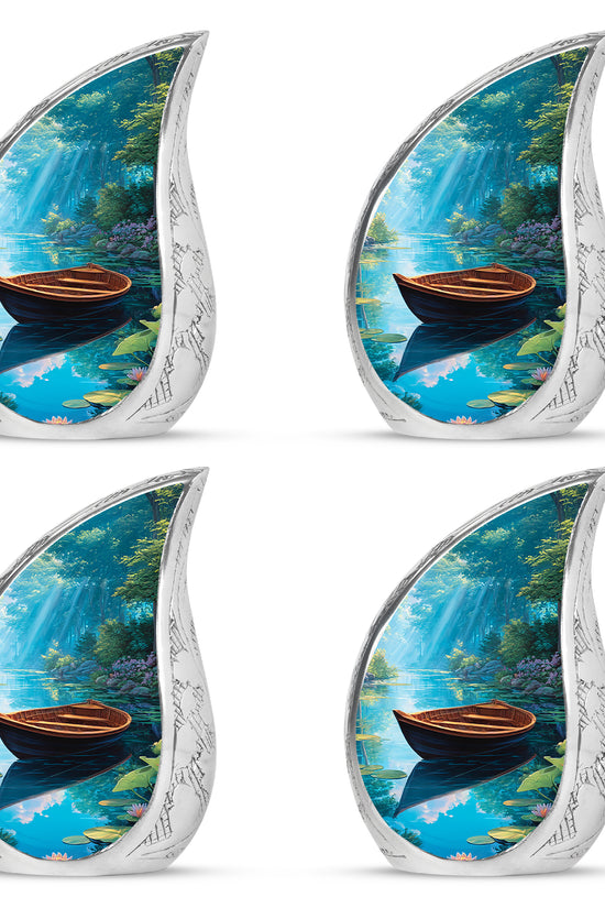 Soft Blue Boat Cremation Urn close-up of engraving and surface detail - smooth teardrop contour featuring boat art - 10 inch aluminum urn for cremated remains