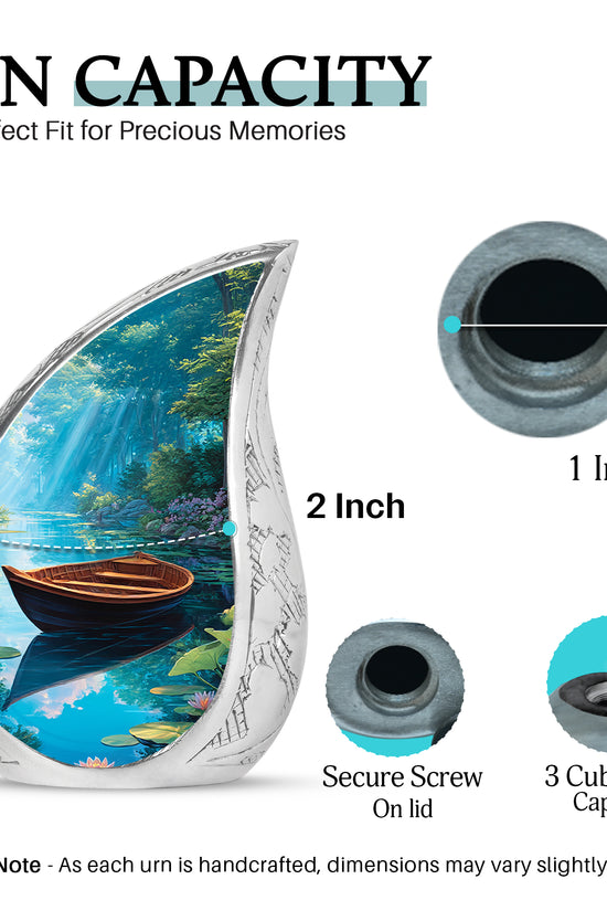 Indigo Boat Cremation Urn angled view of lid and engraved motif - flowing teardrop boat silhouette on curved aluminum - mini keepsake memorial for portion of cremation ashes