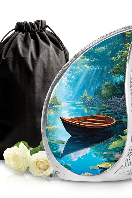 Pastel Blue Boat Cremation Urn front view showing detailed design - flowing teardrop boat silhouette on curved aluminum - full-size 10 inch 200 cubic inch adult cremation urn
