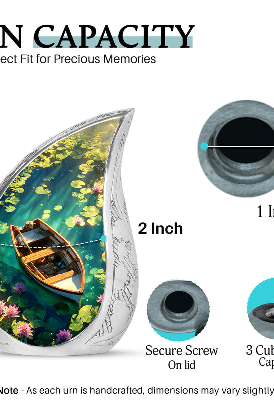 Icy Blue Boat Cremation Urn angled view of lid and engraved motif - flowing teardrop boat silhouette on curved aluminum - mini keepsake memorial for portion of cremation ashes