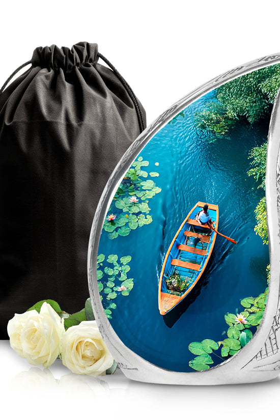 Soft Teal Boat Cremation Urn front view showing detailed design - flowing teardrop boat silhouette on curved aluminum - full-size 10 inch 200 cubic inch adult cremation urn