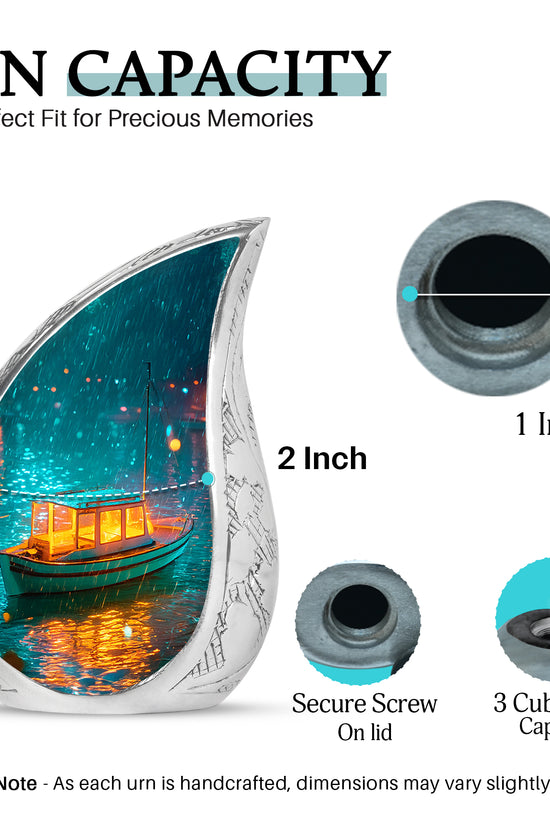 Ocean Teal Boat Cremation Urn angled view of lid and engraved motif - rounded teardrop boat design with delicate detail - mini keepsake memorial for portion of cremation ashes