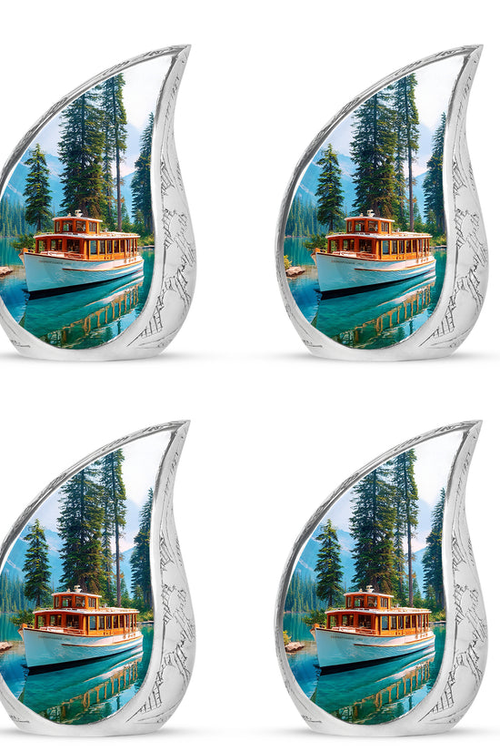 Royal Blue Boat Cremation Urn close-up of engraving and surface detail - graceful tear-shaped urn with boat motif - 10 inch aluminum urn for cremated remains