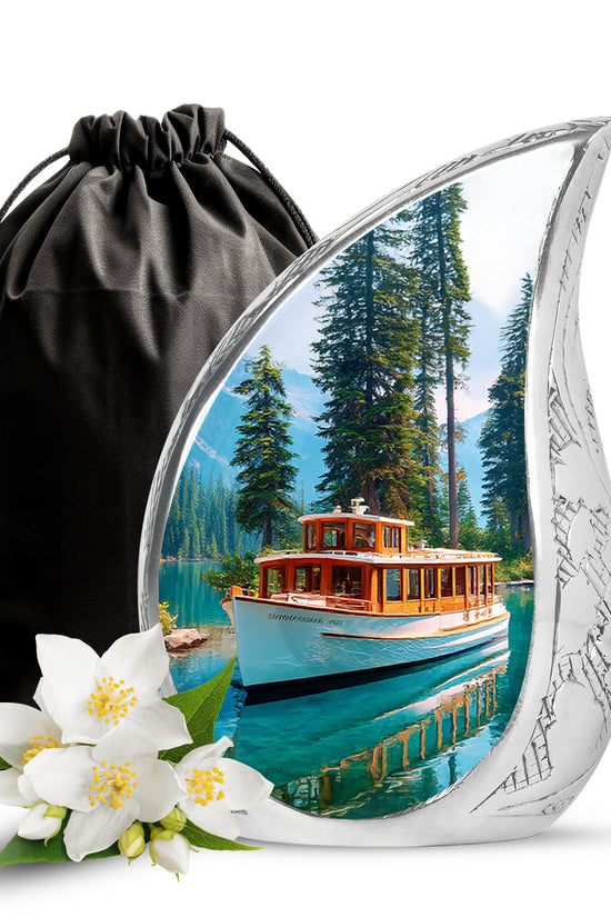 Azure Boat Cremation Urn front view showing detailed design - flowing teardrop boat silhouette on curved aluminum - full-size 10 inch 200 cubic inch adult cremation urn