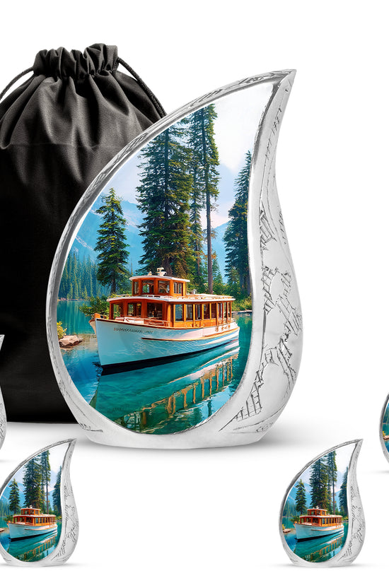 Cobalt Blue Boat Cremation Urn side profile showing urn shape - graceful tear-shaped urn with boat motif - memorial set with one large and four small urns