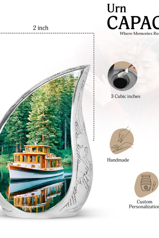 Mystic Teal Boat Cremation Urn angled view of lid and engraved motif - smooth teardrop contour featuring boat art - mini keepsake memorial for portion of cremation ashes