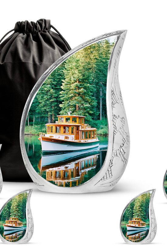 Deep Teal Boat Cremation Urn side profile showing urn shape - smooth teardrop contour featuring boat art - memorial set with one large and four small urns