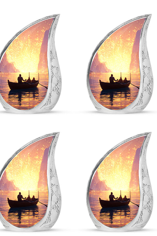 Cherry Red Boat Cremation Urn close-up of engraving and surface detail - graceful tear-shaped urn with boat motif - 10 inch aluminum urn for cremated remains