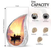 Cherry Red Boat Cremation Urn angled view of lid and engraved motif - smooth teardrop contour featuring boat art - mini keepsake memorial for portion of cremation ashes