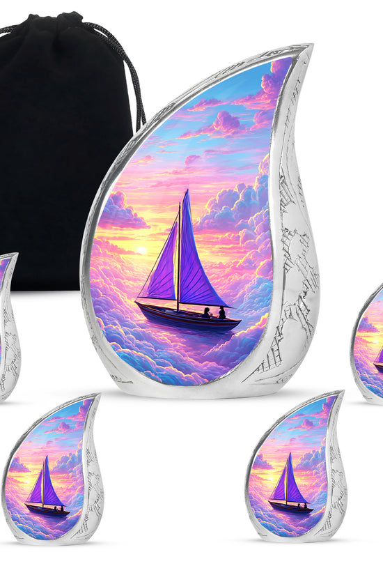 Cobalt Blue Boat Cremation Urn side profile showing urn shape - smooth teardrop contour featuring boat art - memorial set with one large and four small urns