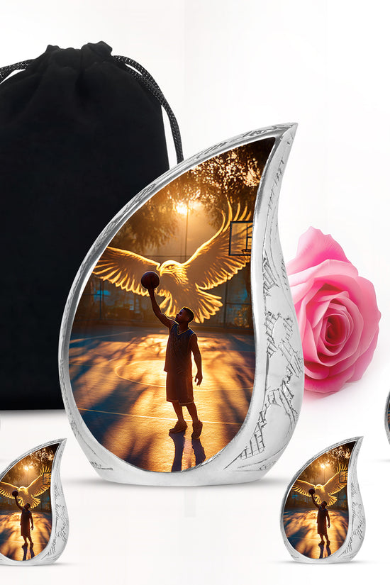 Charcoal Black Basketball Cremation Urn side profile showing urn shape - smooth teardrop contour featuring basketball art - memorial set with one large and four small urns