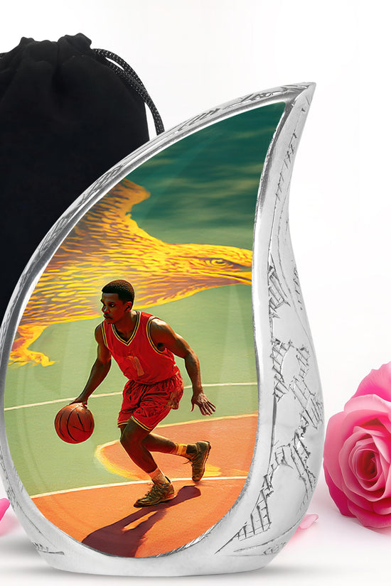 Soft Teal Basketball Cremation Urn front view showing detailed design - flowing teardrop basketball silhouette on curved aluminum - full-size 10 inch 200 cubic inch adult cremation urn