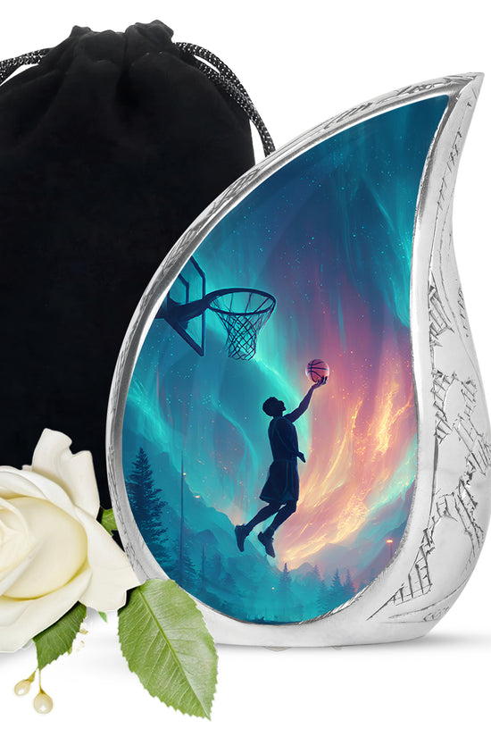 Celestial Blue Basketball Cremation Urn front view showing detailed design - flowing teardrop basketball silhouette on curved aluminum - full-size 10 inch 200 cubic inch adult cremation urn