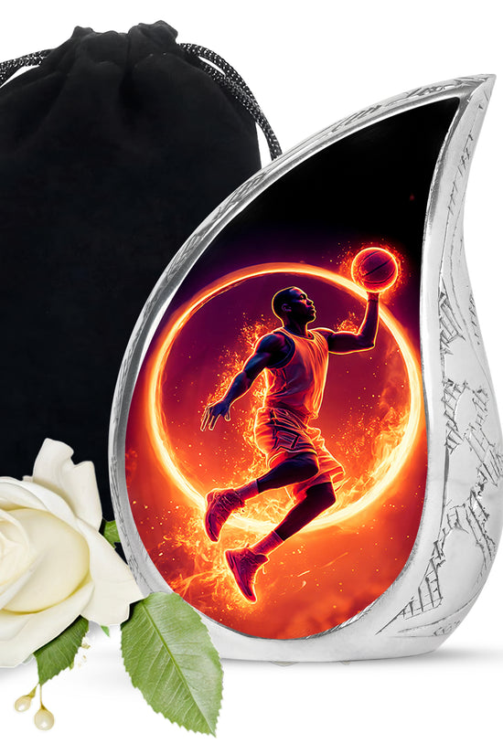 Rich Black Basketball Cremation Urn front view showing detailed design - flowing teardrop basketball silhouette on curved aluminum - full-size 10 inch 200 cubic inch adult cremation urn