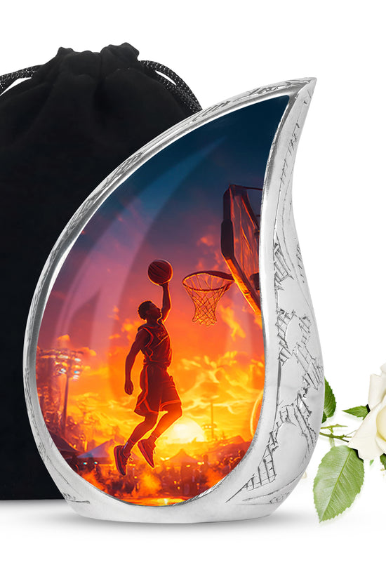 Azure Basketball Cremation Urn front view showing detailed design - flowing teardrop basketball silhouette on curved aluminum - full-size 10 inch 200 cubic inch adult cremation urn