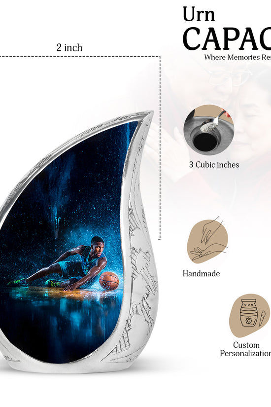 Glossy Black Basketball Cremation Urn angled view of lid and engraved motif - flowing teardrop basketball silhouette on curved aluminum - mini keepsake memorial for portion of cremation ashes