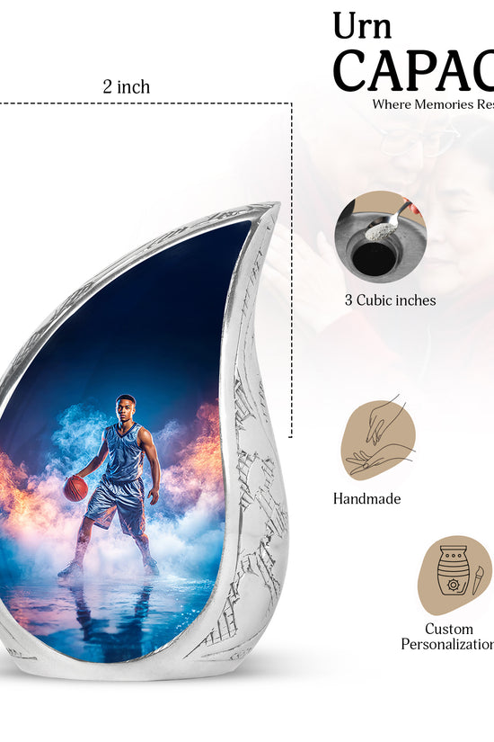 Pastel Blue Basketball Cremation Urn angled view of lid and engraved motif - flowing teardrop basketball silhouette on curved aluminum - mini keepsake memorial for portion of cremation ashes