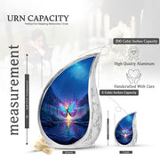 Icy Blue Butterfly Cremation Urn angled view of lid and engraved motif - rounded teardrop butterfly design with delicate detail - mini keepsake memorial for portion of cremation ashes