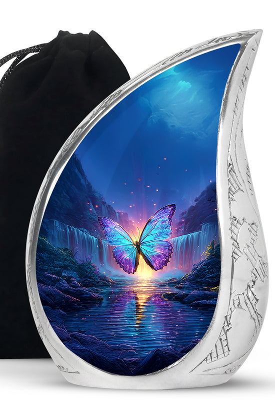 Indigo Butterfly Cremation Urn front view showing detailed design - flowing teardrop butterfly silhouette on curved aluminum - full-size 10 inch 200 cubic inch adult cremation urn