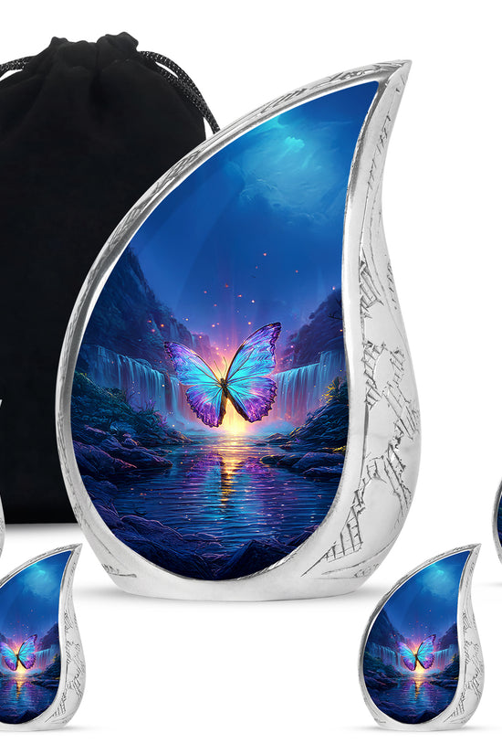 Sapphire Blue Butterfly Cremation Urn side profile showing urn shape - graceful tear-shaped urn with butterfly motif - memorial set with one large and four small urns
