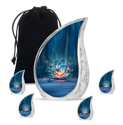 Indigo Butterfly Cremation Urn side profile showing urn shape - rounded teardrop butterfly design with delicate detail - memorial set with one large and four small urns