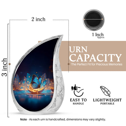 Serene Blue Butterfly Cremation Urn angled view of lid and engraved motif - smooth teardrop contour featuring butterfly art - mini keepsake memorial for portion of cremation ashes