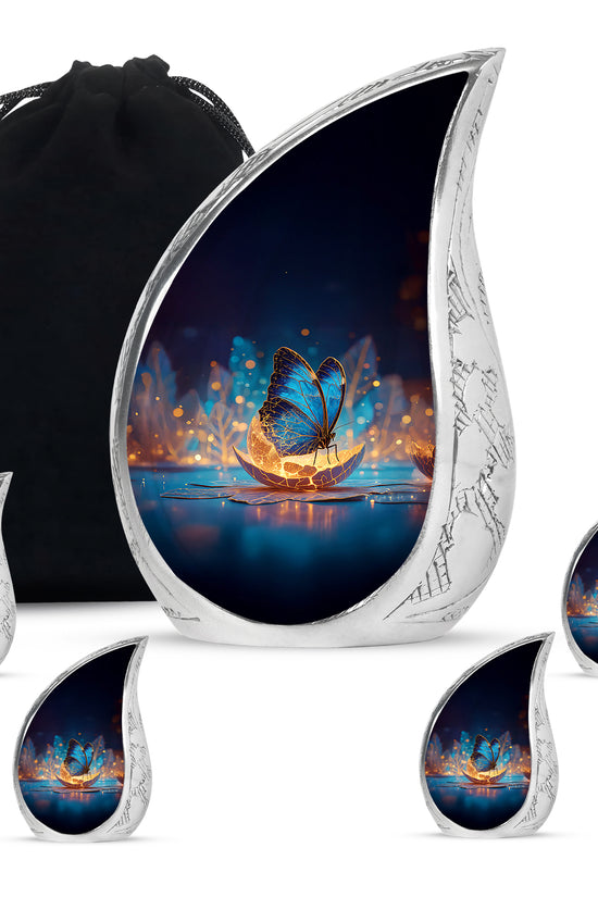 Sky Blue Butterfly Cremation Urn side profile showing urn shape - flowing teardrop butterfly silhouette on curved aluminum - memorial set with one large and four small urns