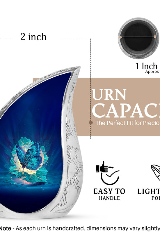 Dusty Blue Butterfly Cremation Urn angled view of lid and engraved motif - rounded teardrop butterfly design with delicate detail - mini keepsake memorial for portion of cremation ashes