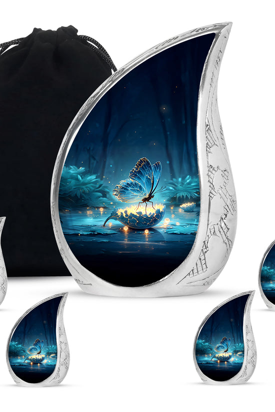 Navy Blue Butterfly Cremation Urn side profile showing urn shape - flowing teardrop butterfly silhouette on curved aluminum - memorial set with one large and four small urns