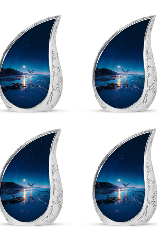 Misty Blue Butterfly Cremation Urn close-up of engraving and surface detail - rounded teardrop butterfly design with delicate detail - 10 inch aluminum urn for cremated remains